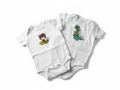 Elise Fay two-pack white cotton baby bodysuits with embroidered jungle animal and dinosaur designs